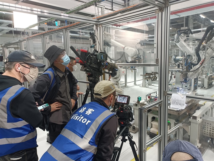 Tianjin production team discussing a brief near a location setup